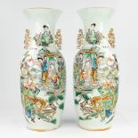 A pair of Chinese vases with a double decor of warriors and ladies, Fauna and flora. 19th/20th C. (H