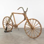 An antique bicycle completely made of wood, circa 1900. (L: 54 x W: 185 x H: 100 cm)