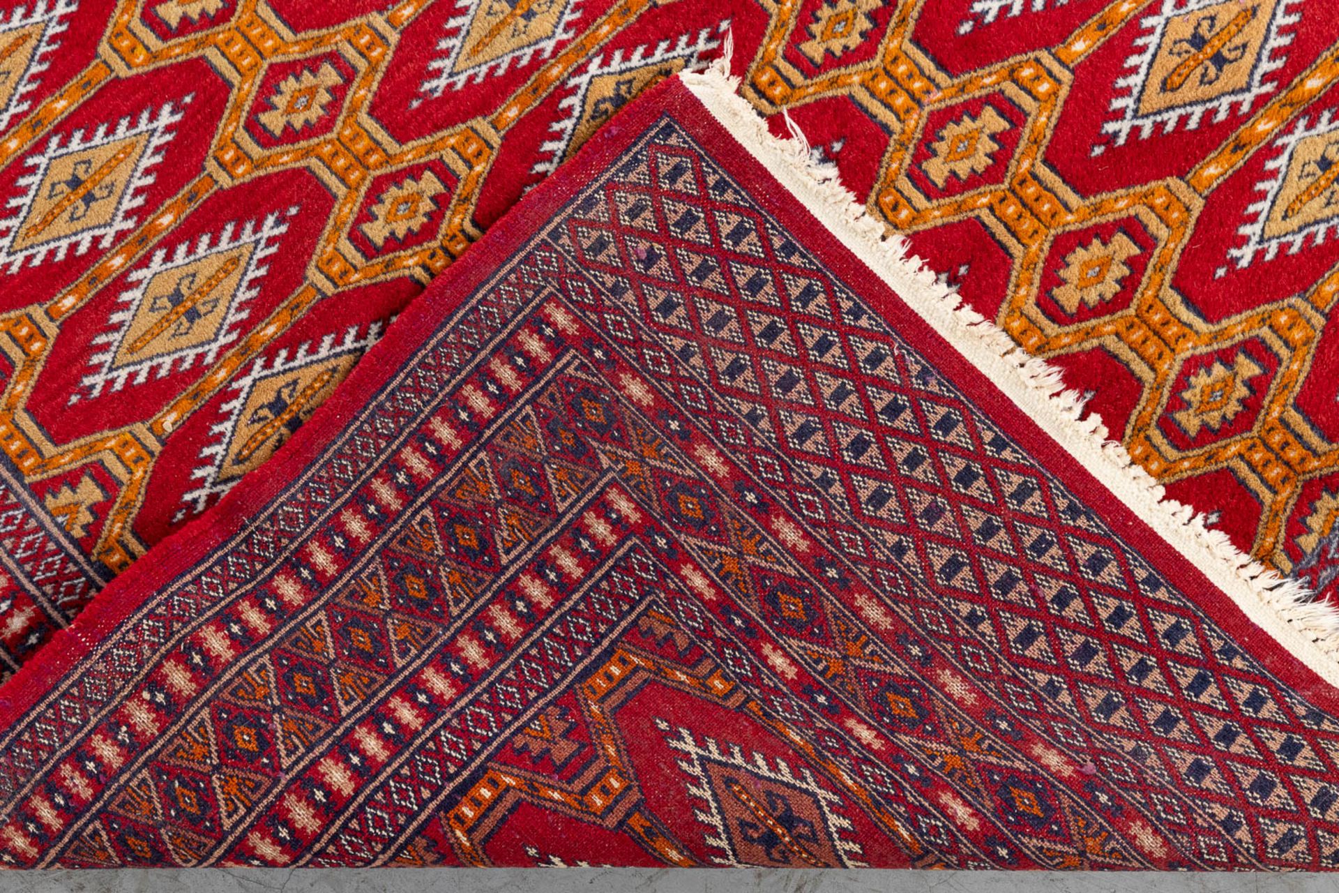 A set of 2 Oriental hand-made carpets, Bokhara/Buchara. (125 x 87 cm)(124 x 170 cm). (L: 124 x W: 17 - Image 10 of 11