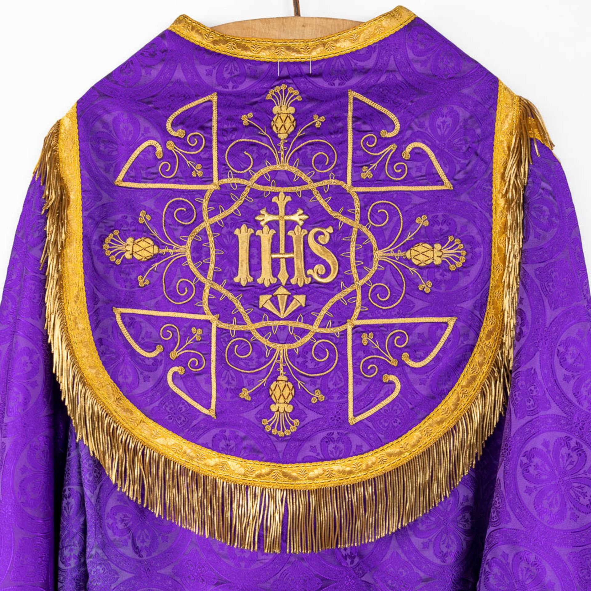 A Cope and Humeral Veil, finished with thick gold thread and purple fabric and the IHS logo. - Image 8 of 12