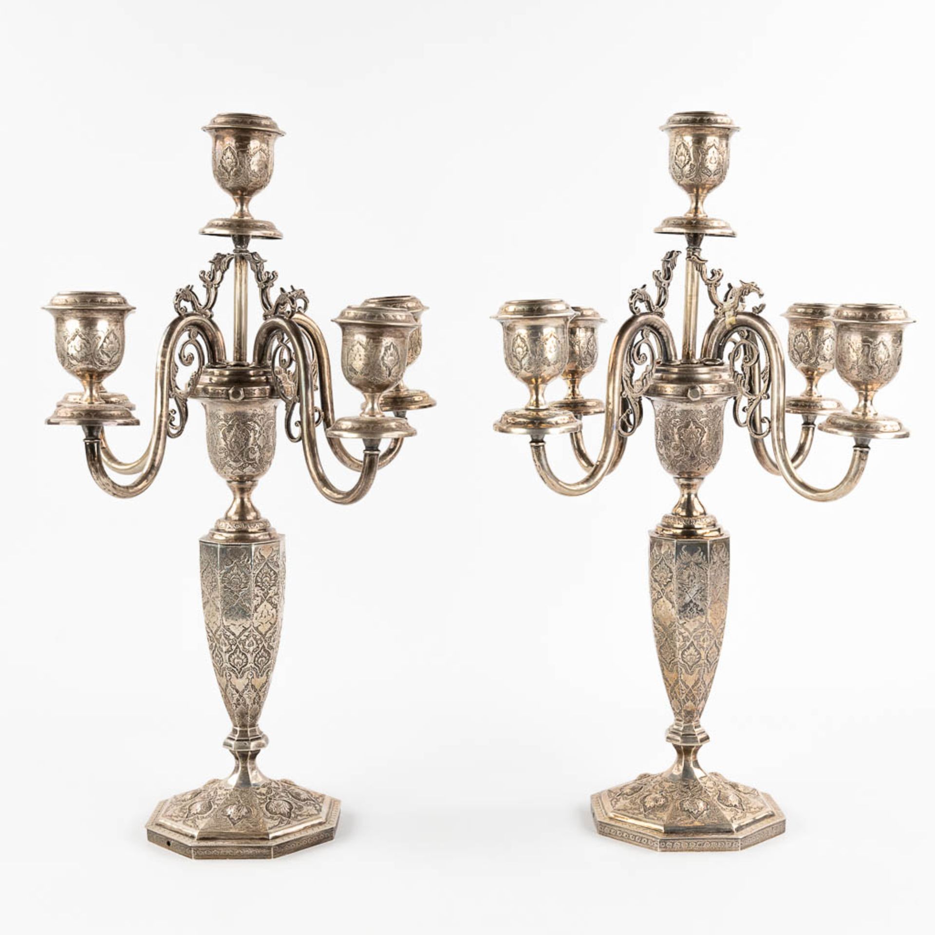 A pair of candelabra, silver, probably Middle-East. 3,650g.