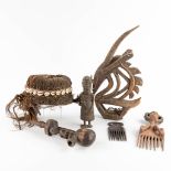 A collection of African objects, Chiwara, Benin, 2 combs, Songye Pipe. (L: 8,5 x W: 25 x H: 46 cm)