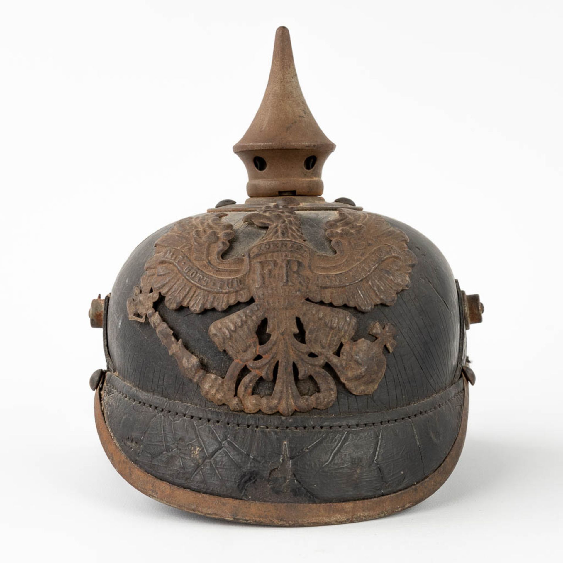 An antique German Pickelhaube. Leather and copper. (L: 18 x W: 23 x H: 20 cm)
