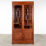 A Chinese display cabinet, wood and glass. 20th C. (L: 41 x W: 102 x H: 200 cm)