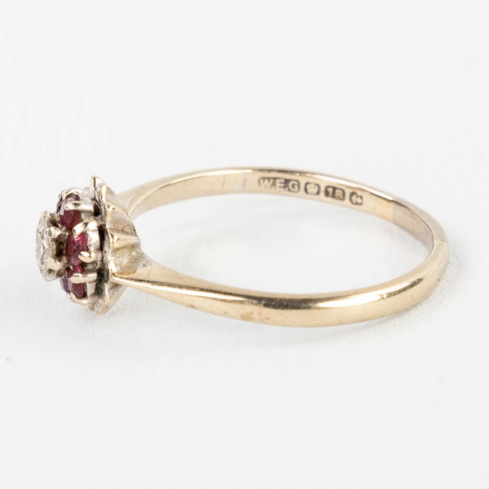 A white-gold ring with cut rubies and a brilliant, made in Birmingham, UK. 2,68g. size: 56. - Image 8 of 11