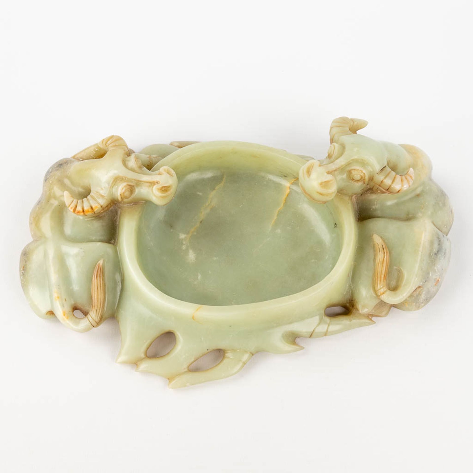 A Chinese brush washer, decorated with water buffalo, sculptured jade. (L: 18 x W: 28 x H: 8 cm)