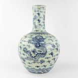 A Chinese ball vase with blue-white dragon decor. 19th/20th C. (H: 61 x D: 38 cm)