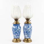 A pair of antique oil lamps, ceramic, glass and brass. (W: 17 x H: 62 cm)
