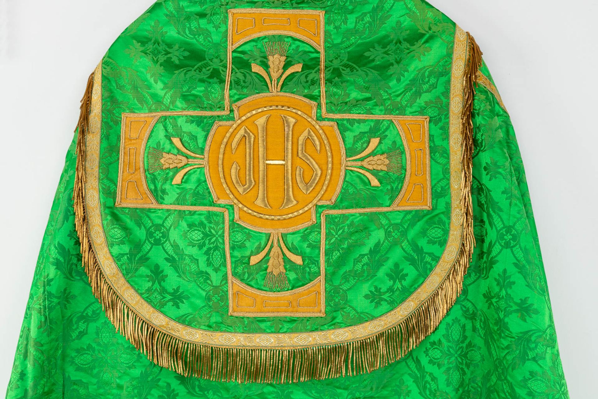 A Cope and Humeral Veil, finished with thick gold thread and green fabric and the IHS logo. - Image 4 of 14