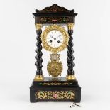 A column clock finished with copper inlay in Napoleon 3 style. 19th C. (L: 14 x W: 25 x H: 48 cm)