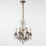 A small chandelier with purple and clear glass beads. (H: 50 x D: 37 cm)
