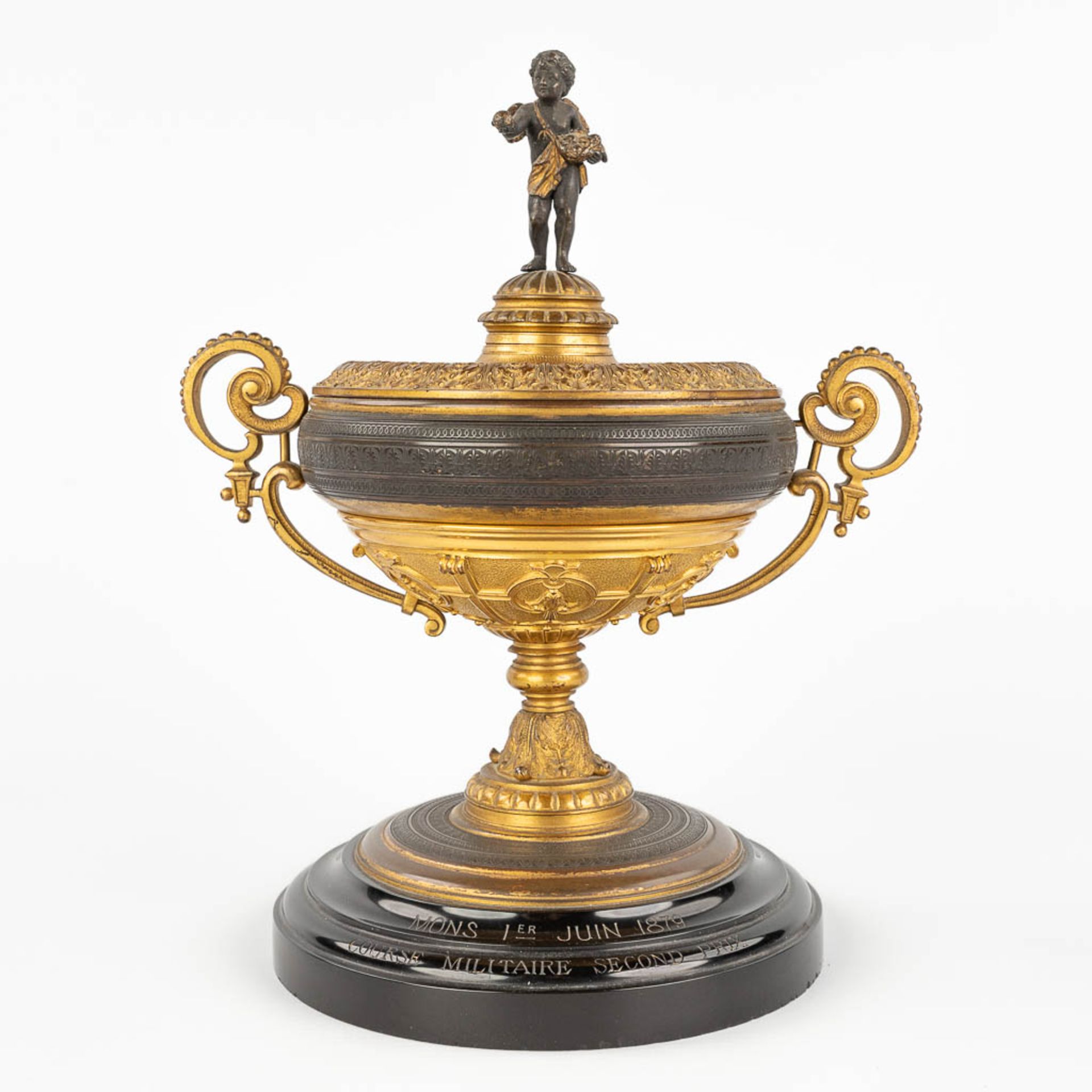 An antique trophy, made of gilt and patinated bronze. 19th C. (L: 16 x W: 22 x H: 27 cm)