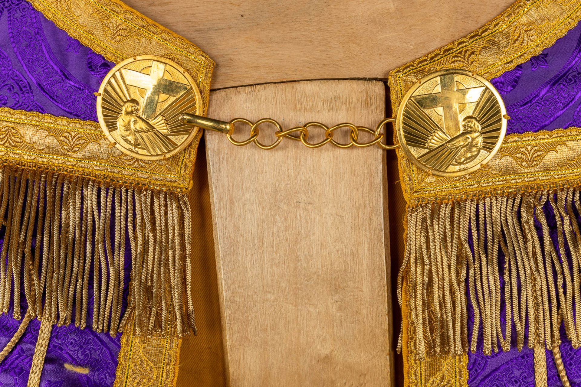 A Cope and Humeral Veil, finished with thick gold thread and purple fabric and the IHS logo. - Image 11 of 12