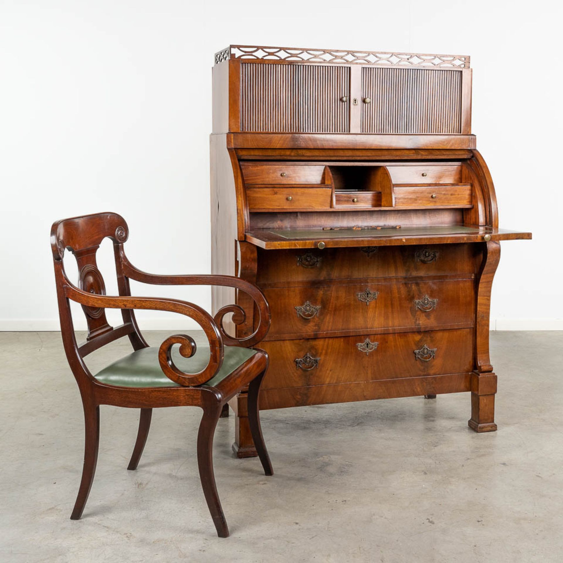 A commode Secretaire, with rolling shutters, mahogany veneer and a matching armchair. 19th century.