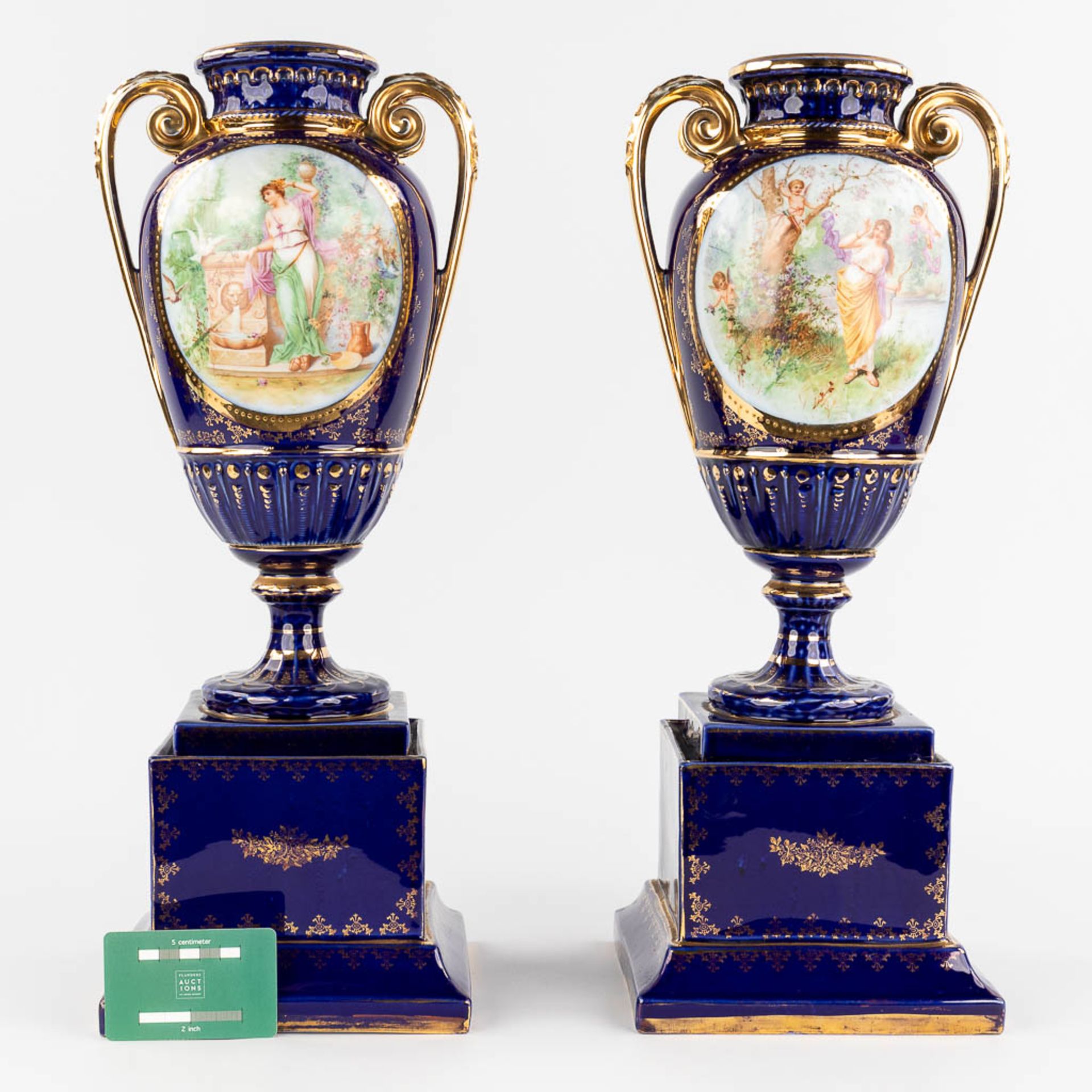 A pair of vases, with a transferprint decor. 20th C. (L: 18 x W: 18 x H: 50 cm) - Image 2 of 12