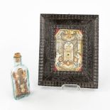 A reliquary frame, De Cruce and S. Pignativs, added a bottle with crucifix. 19th C. (W: 18 x H: 22 c