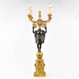 Pierre Chibout, An antique candelabra, decorated with an angel, patinated and gilt bronze, Empire pe