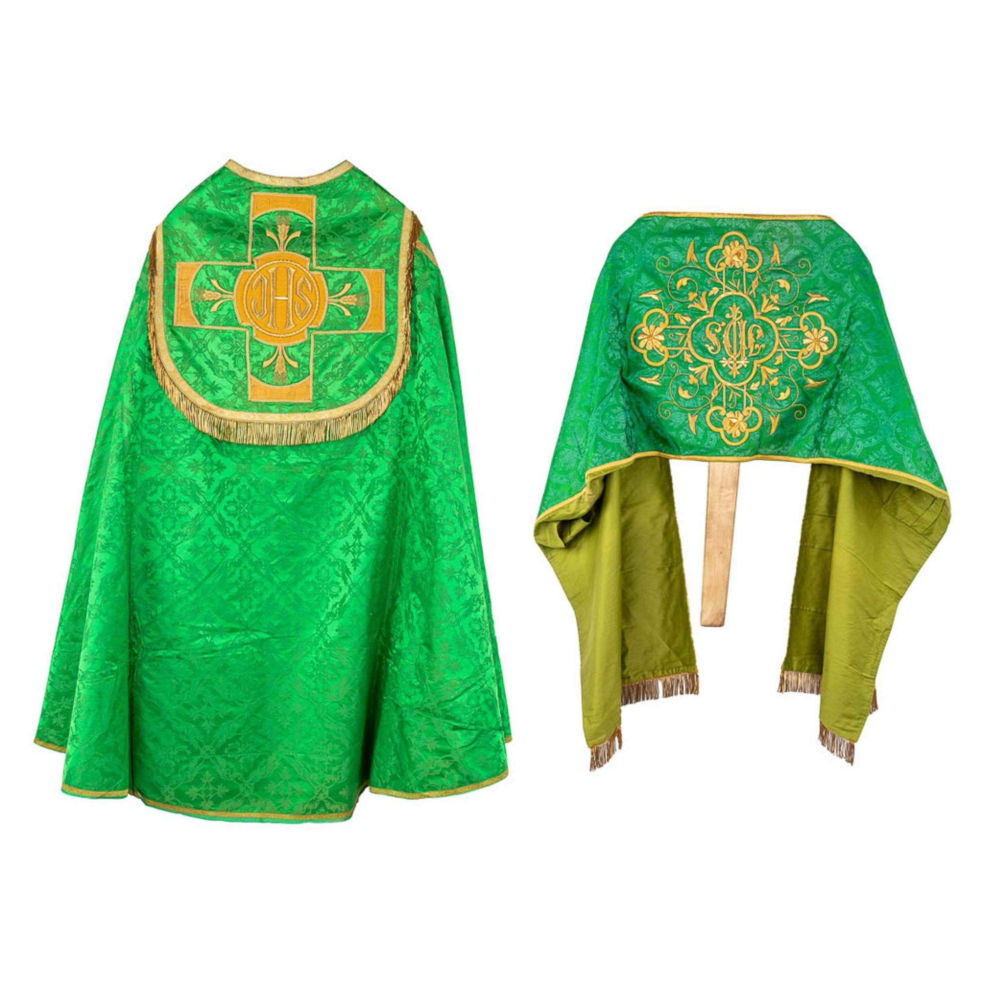 A Cope and Humeral Veil, finished with thick gold thread and green fabric and the IHS logo.