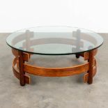 A mid-century round coffee table, rosewood with a glass top. (H: 43 x D: 110 cm)