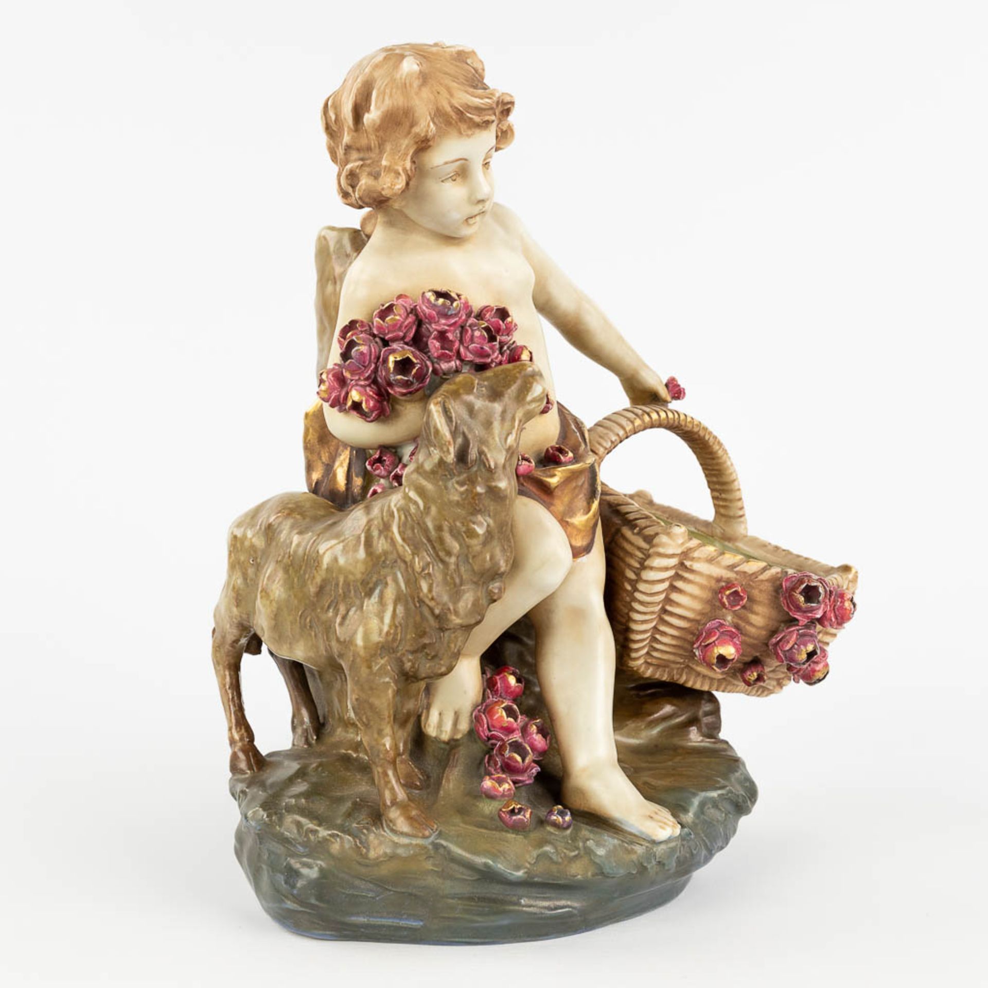 Amphora Austria, 'Child with a basket and sheep' made of glazed faience. (L: 18 x W: 24 x H: 29,5 cm - Image 3 of 14