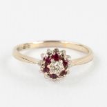 A white-gold ring with cut rubies and a brilliant, made in Birmingham, UK. 2,68g. size: 56.