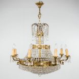 A brass and glass chandelier 'Robe ˆ Perles', finished with small porcelain plaques. 20th C. (H: 100