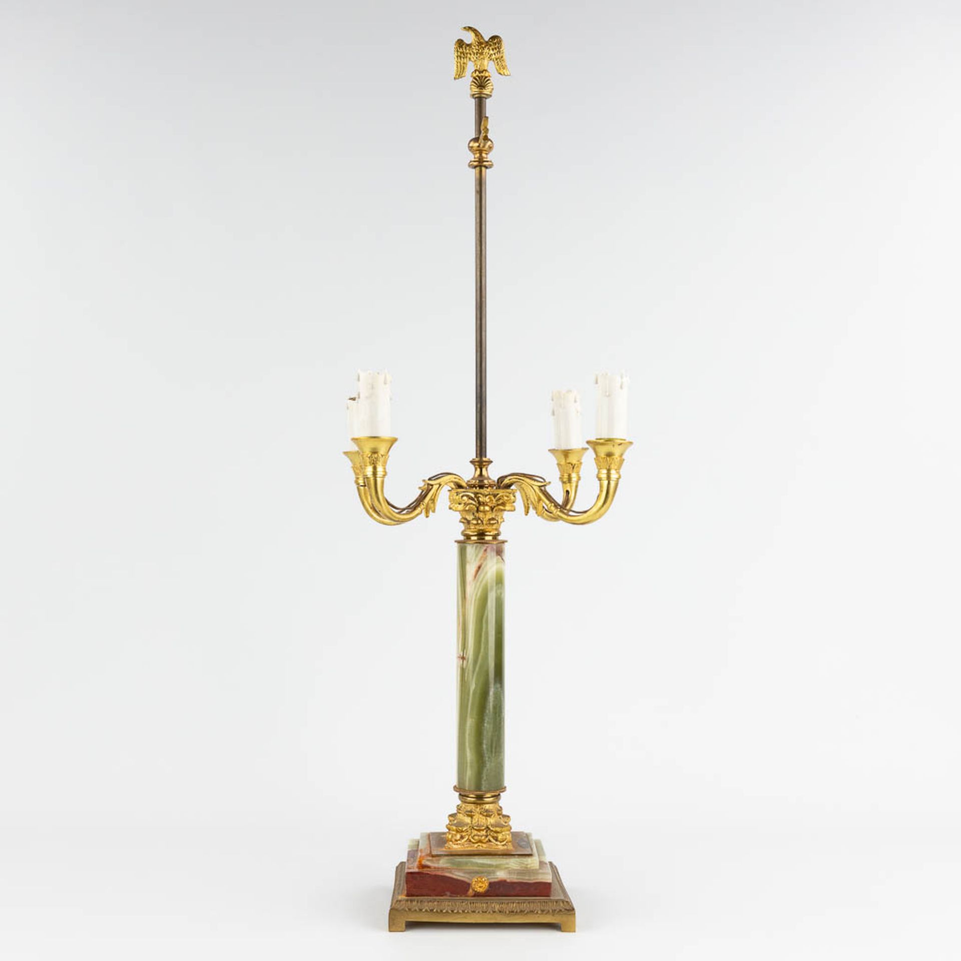 A table lamp, brass and onyx. 20th century. (L: 30 x W: 30 x H: 77 cm)