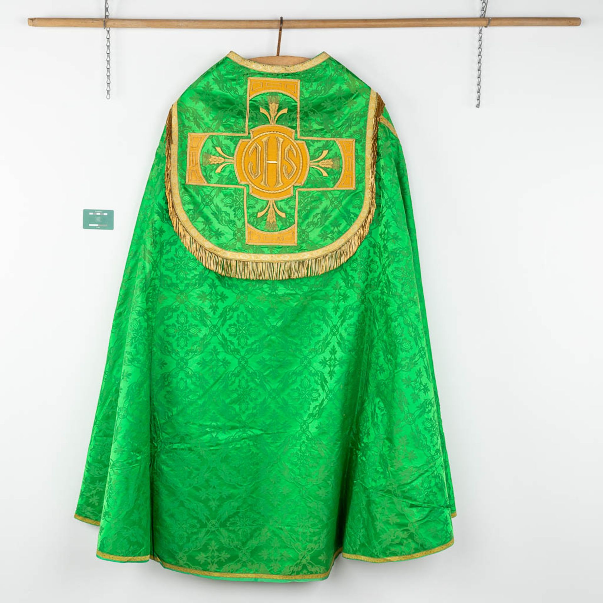 A Cope and Humeral Veil, finished with thick gold thread and green fabric and the IHS logo. - Image 2 of 14