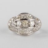 An antique ring with 5 larger and 36 smaller brilliants, in a platinum ring. 9,57g. size: 53