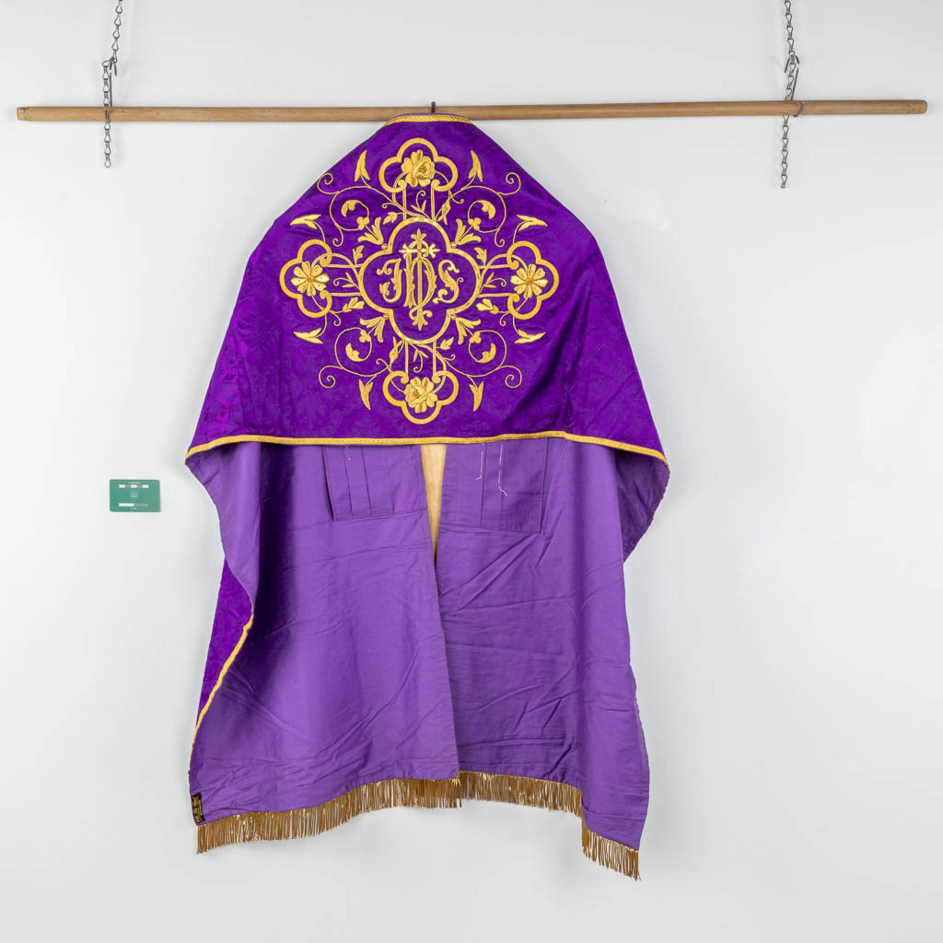 A Cope and Humeral Veil, finished with thick gold thread and purple fabric and the IHS logo. - Image 2 of 12