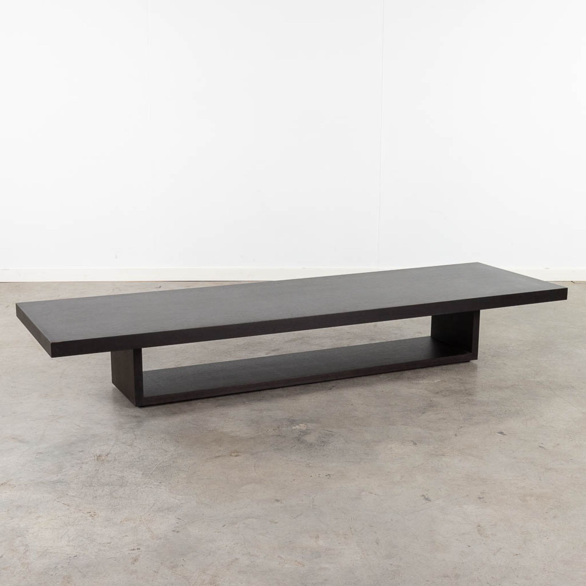 Cassina, a coffee table, ebonised wood. Not signed. (L: 200 x W: 60 x H: 30 cm)