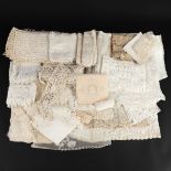 A collection of lithurgical-inspired lace and lace work. A baptism robe, napkins, bursa and multiple