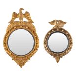 A collection of 2 round mirrors with an eagle, Hollywood Regency style. 20th C. (W: 52 x H: 65 cm)