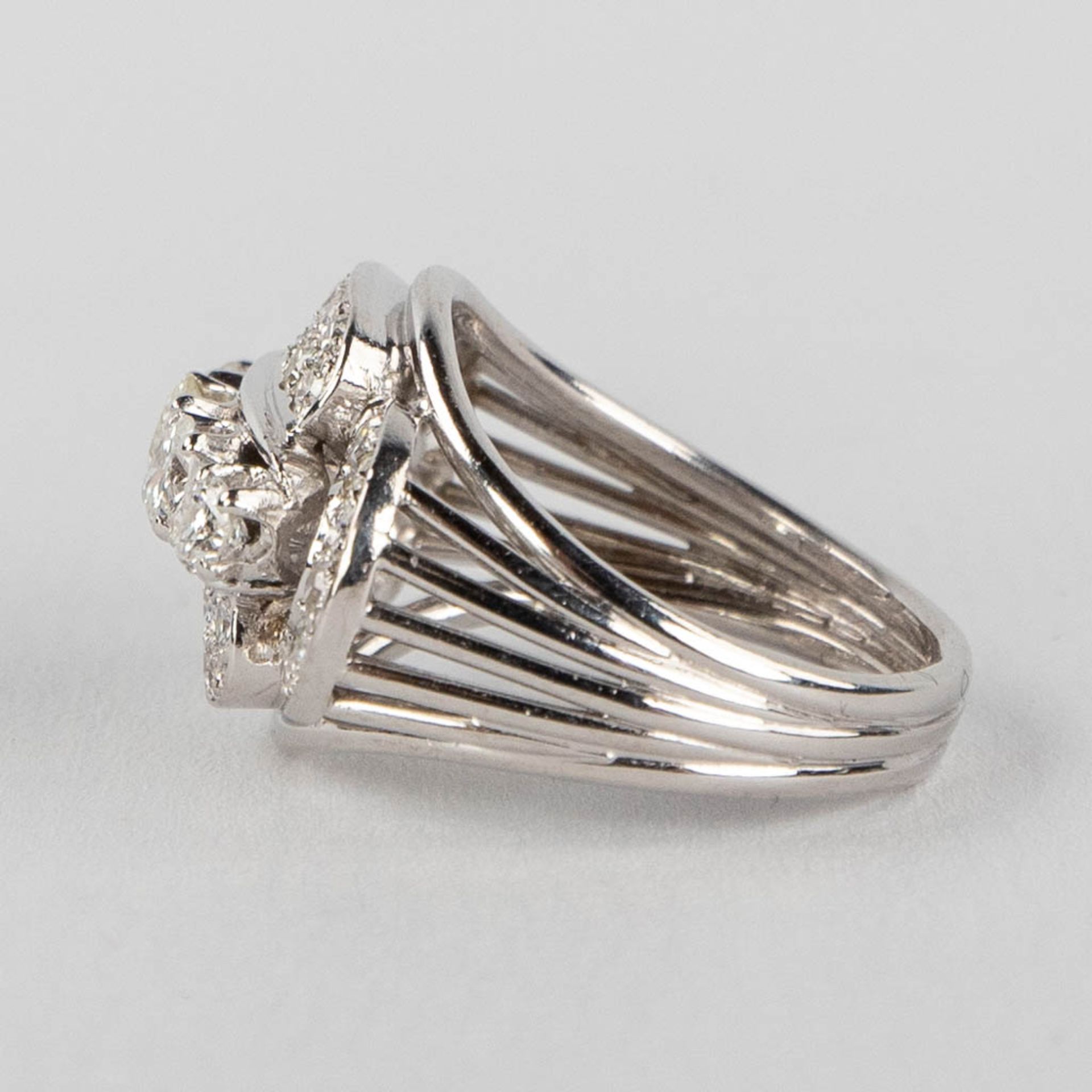 An antique ring with 5 larger and 36 smaller brilliants, in a platinum ring. 9,57g. size: 53 - Image 7 of 12