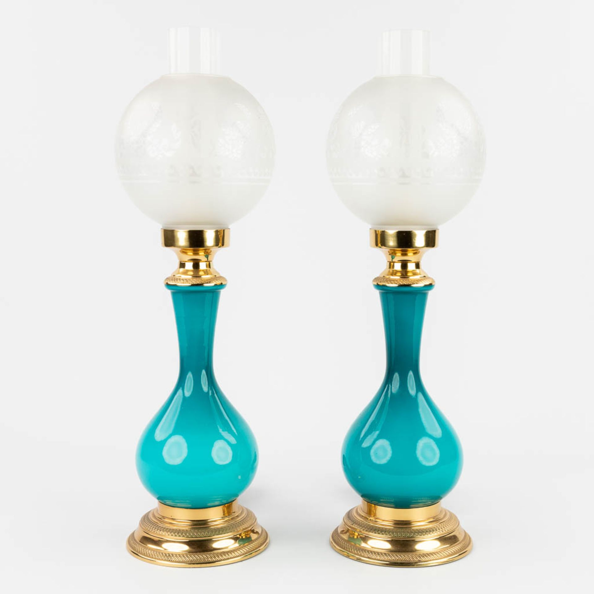 A pair of table lamps, opaline blue glass mounted with bronze. 20th C. (H: 49 x D: 15 cm)