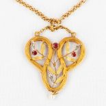 An antique pendant with rubies, brilliant cut stones and a cultured pearl, yellow gold in Art Nouvea