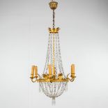 A chandelier 'Sac ˆ Perles', bronze and glass in empire style. 20th C. (H: 100 x D: 50 cm)