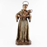 An antique wood-sculptured and polychrome figurine of Saint Anthony with a child. 18th century. (W: