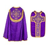 A Cope and Roman Chasuble, decorated with the IHS logo and thick gold thread embroidery.