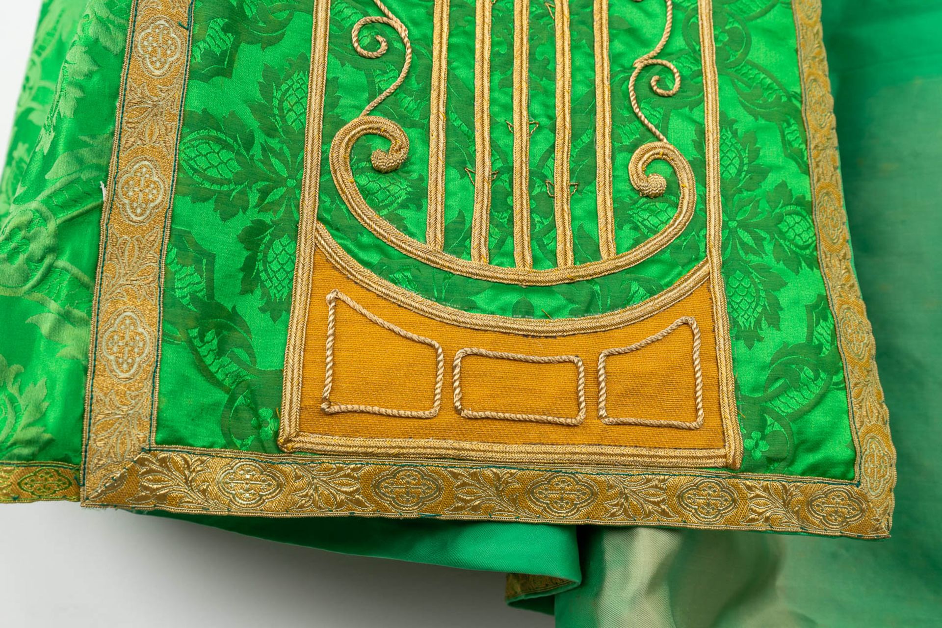 A Cope and Humeral Veil, finished with thick gold thread and green fabric and the IHS logo. - Image 9 of 14