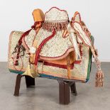 An antique 'Fantasia' saddle, made of camel leather. (W: 100 x H: 70 cm)