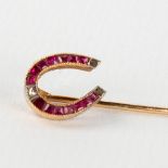 An antique Brooch, 18 karat gold finished with semi- or precious stones and an uncut diamond. Circa