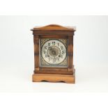 A Victorian Walnut and Stained Beech Mantle Clock