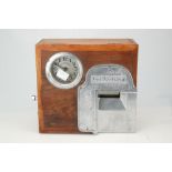 A Stafsine oak cased clocking in clock,