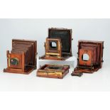A Selection of Part-Complete Mahogany & Brass Folding Cameras,
