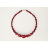A String of Graduated Cherry Amber Beads