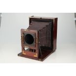 An R. W. Thomas Folding Mahogany & Full Plate Brass Camera,
