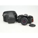 A Canon T-60 35mm SLR Camera,