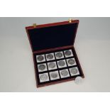 A boxed set of silver plated coins commemorating the History of Christianity,