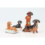 A Basil Matthews Animalier Group of a Dachshund on Cushion,